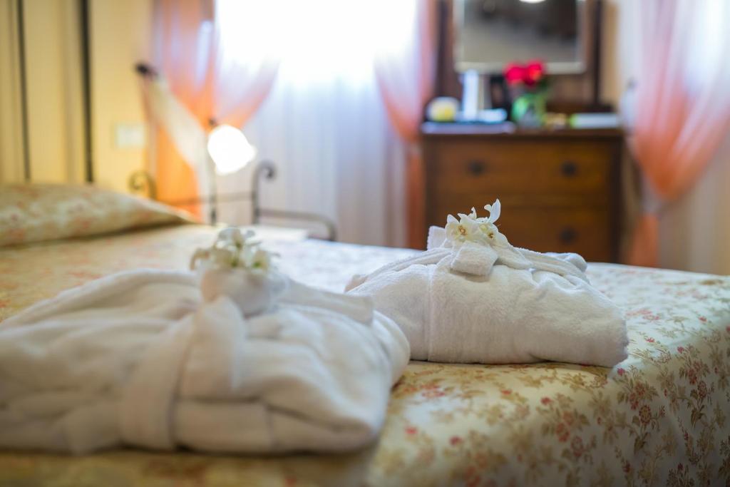 Postel nebo postele na pokoji v ubytování Hotel & SPA L'Antico Forziere