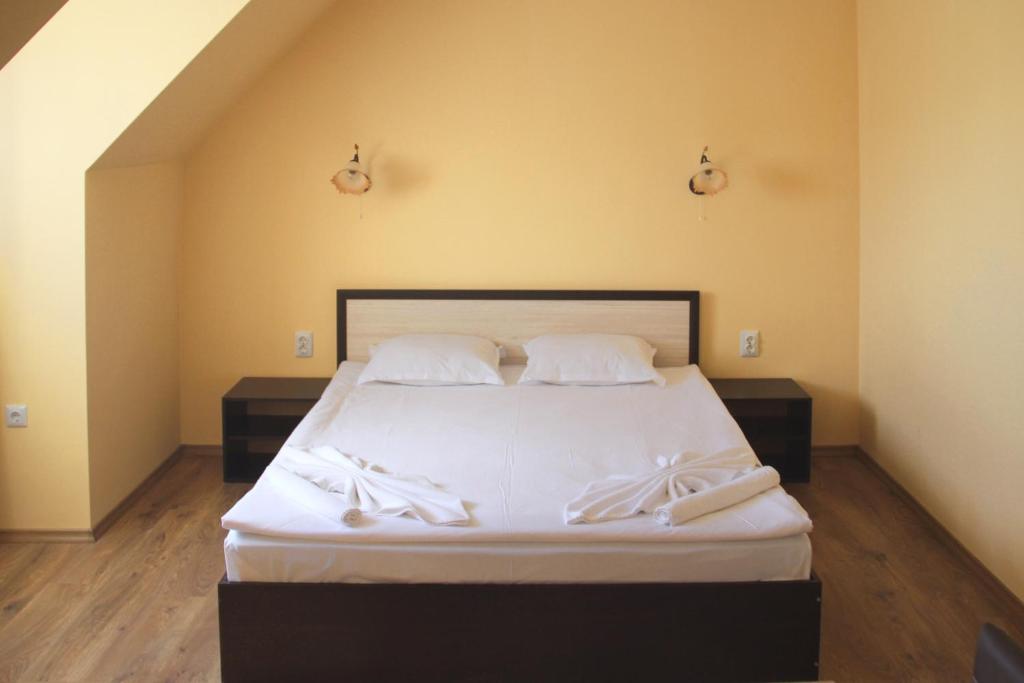 Postel nebo postele na pokoji v ubytování Horizont Apartments