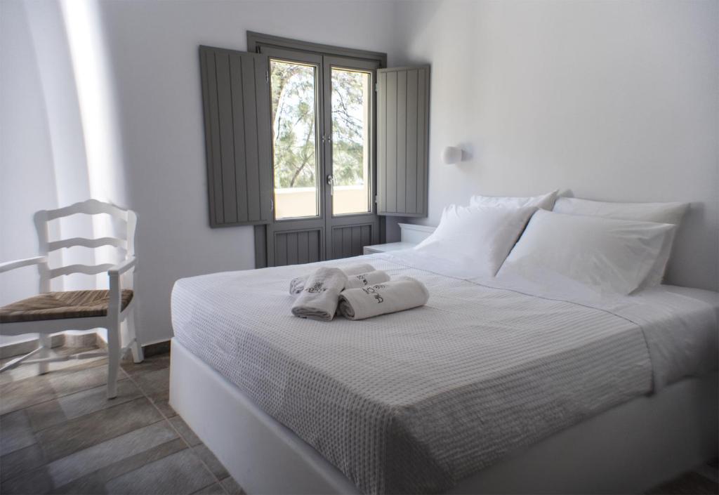 Postel nebo postele na pokoji v ubytování Helios Beach Hotel