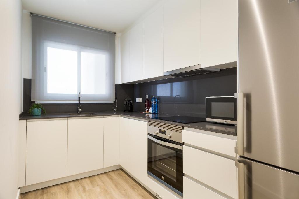 A kitchen or kitchenette at Sitges Group Calm Beach