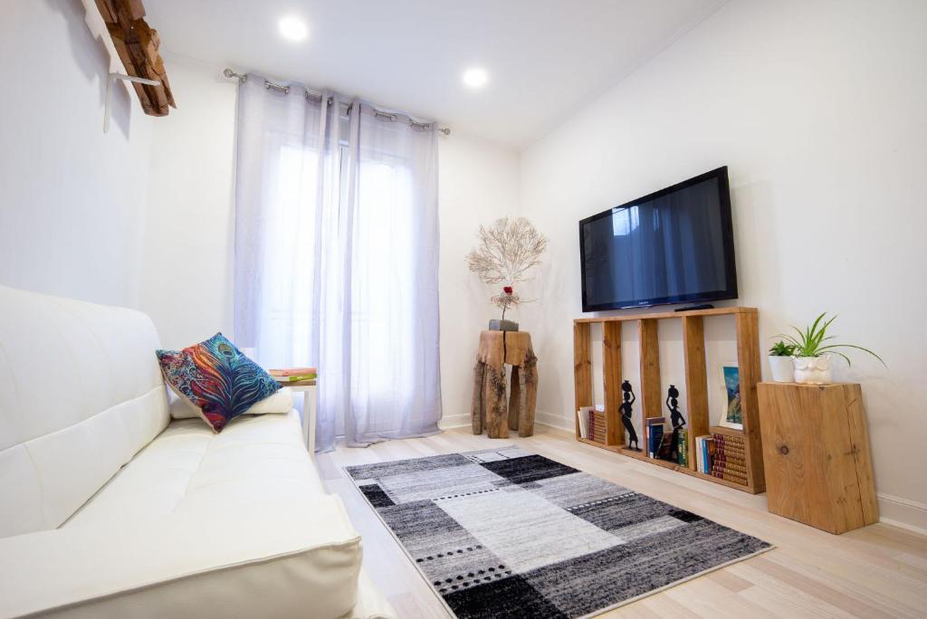 Televízia a/alebo spoločenská miestnosť v ubytovaní Sustraia - Local Rentss