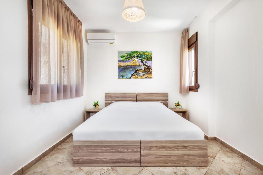 Postel nebo postele na pokoji v ubytování Sunset Villas