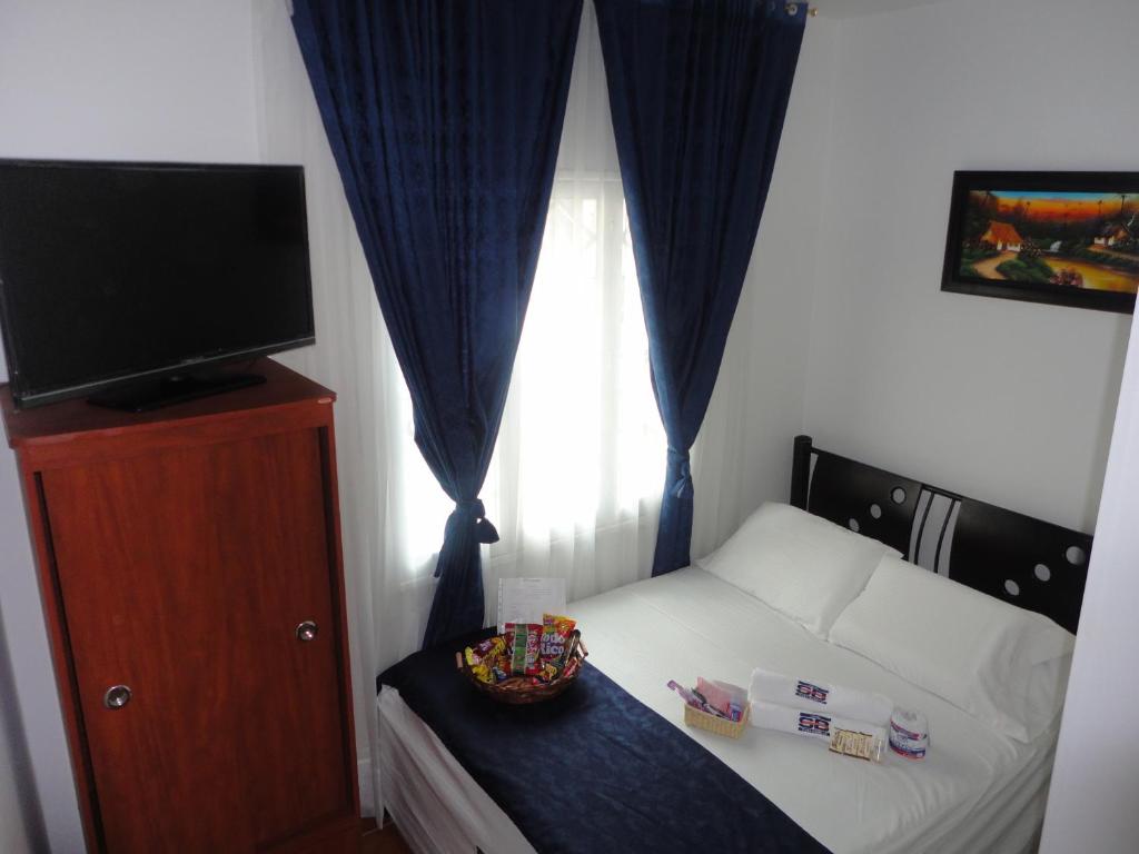 Postel nebo postele na pokoji v ubytování Hotel Casa Sabelle