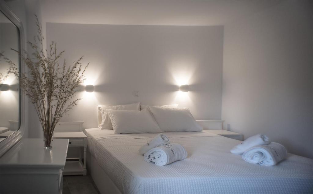 Postel nebo postele na pokoji v ubytování Helios Beach Hotel