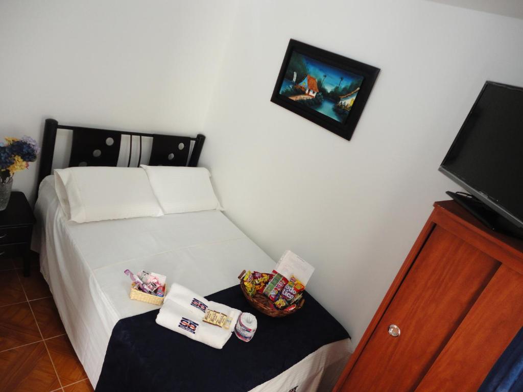 Postel nebo postele na pokoji v ubytování Hotel Casa Sabelle