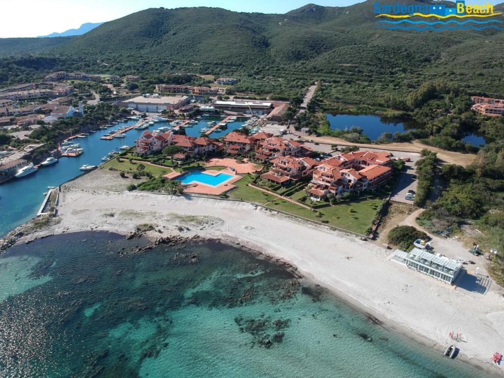 an aerial view of a resort on a beach at Sardegna Beach Cala Reale in Santa Marinella