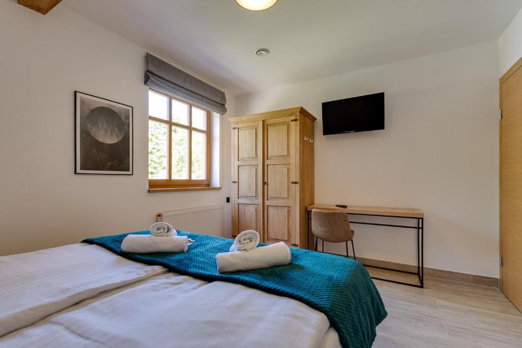 Posteľ alebo postele v izbe v ubytovaní Biała Owieczka B&B Szczyrk