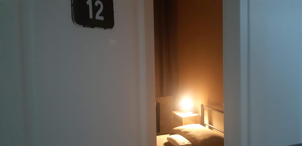 Postel nebo postele na pokoji v ubytování Ostello Tasso