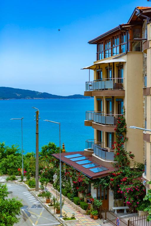 a building with a view of the water at La Casa Primorsko in Primorsko