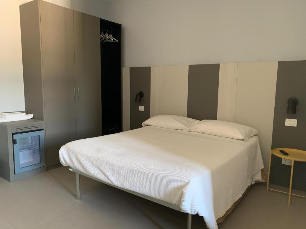 Postel nebo postele na pokoji v ubytování Locanda della Posta