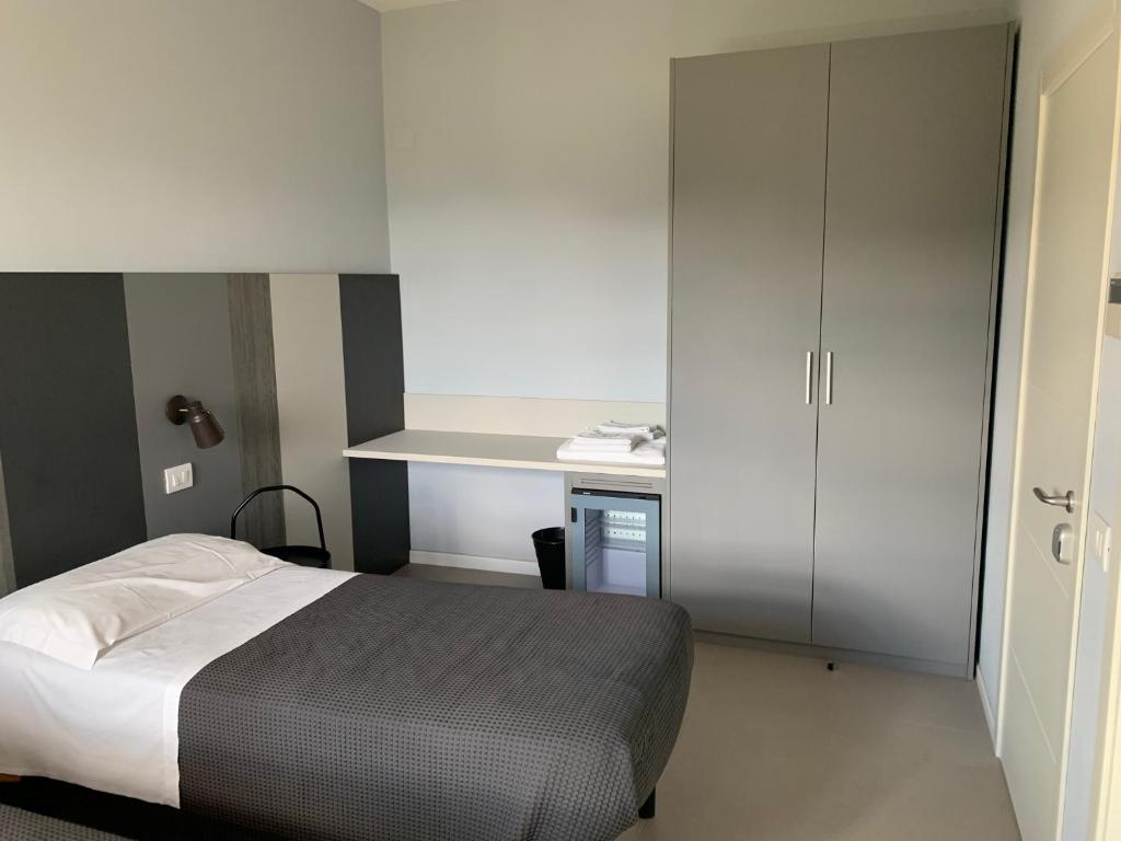 Postel nebo postele na pokoji v ubytování Locanda della Posta
