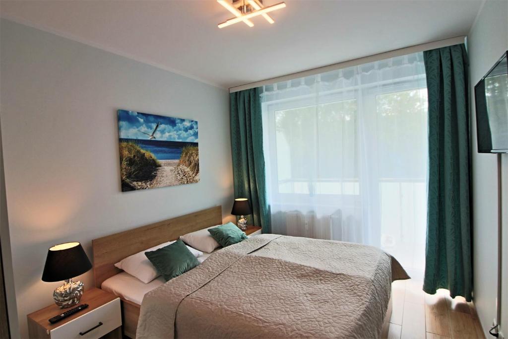 Posteľ alebo postele v izbe v ubytovaní Bliżej Morza Luxury Apartments