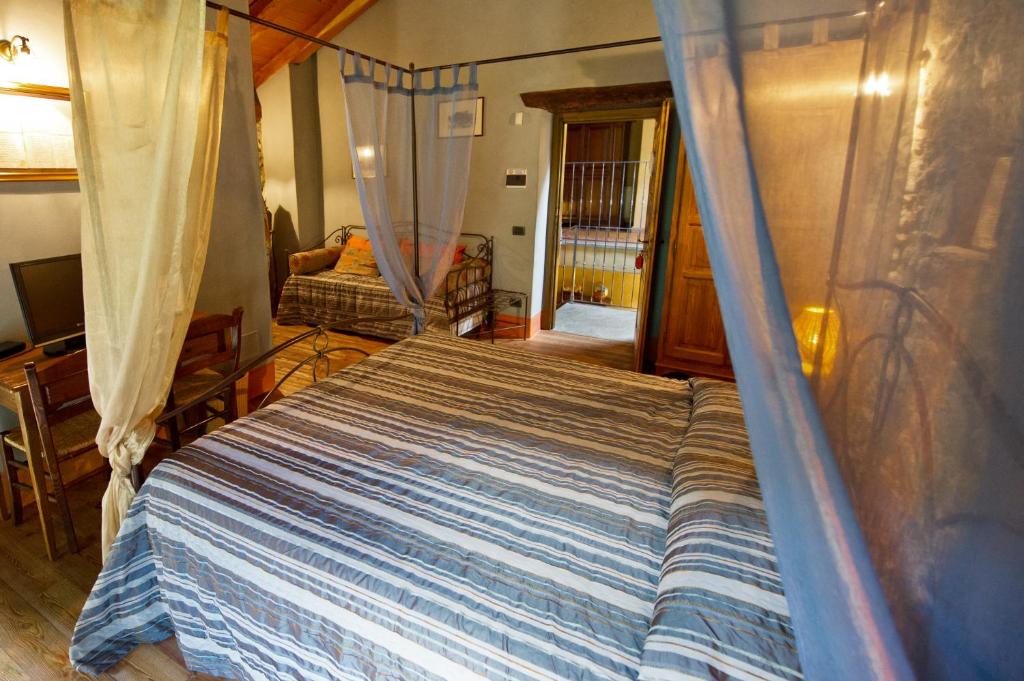 Postel nebo postele na pokoji v ubytování La Maison Des Vignerons Chambres D'Hotes B&B