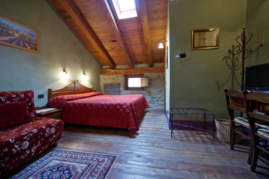 TV a/nebo společenská místnost v ubytování La Maison Des Vignerons Chambres D'Hotes B&B