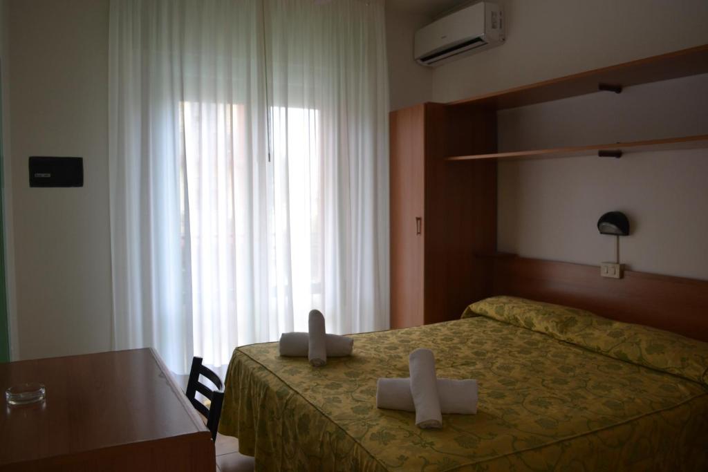 Postel nebo postele na pokoji v ubytování Hotel Mirage