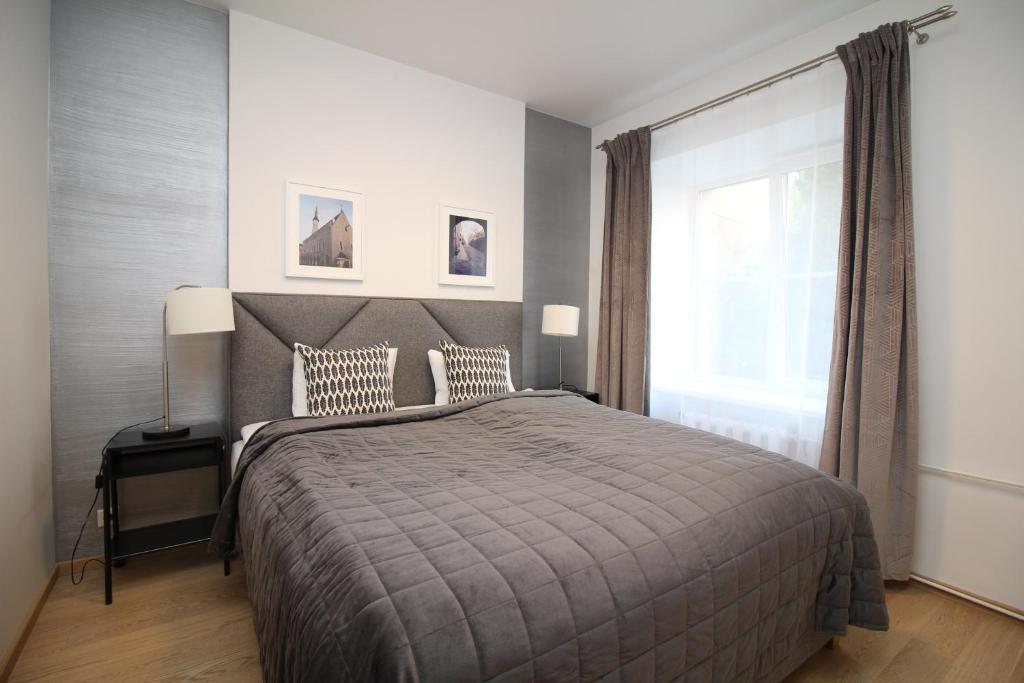 Voodi või voodid majutusasutuse Tallinn City Apartments - Old Town toas