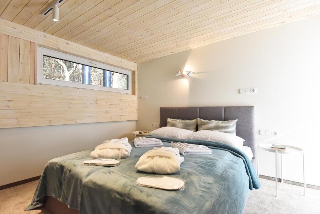 Кровать или кровати в номере Čiki Puki pajūrys