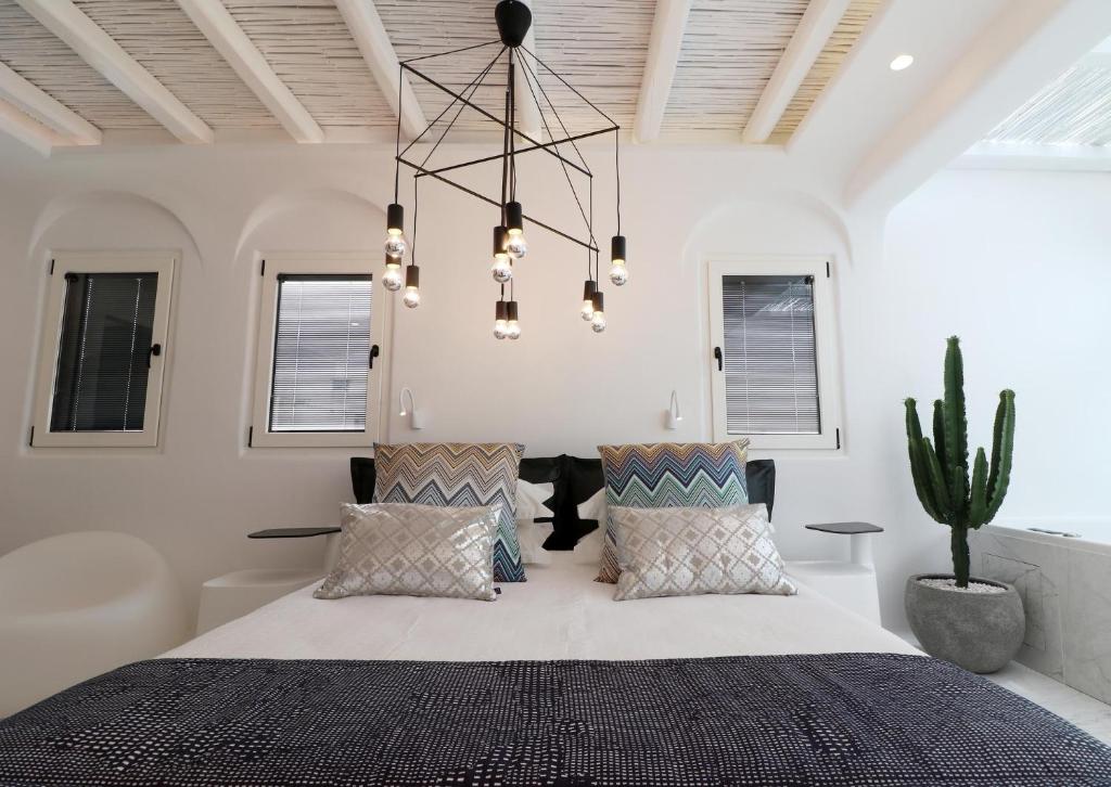 A bed or beds in a room at Narcissus Luxury Suites