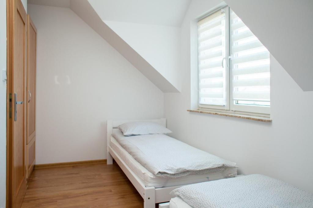 Postel nebo postele na pokoji v ubytování Domki Nordic