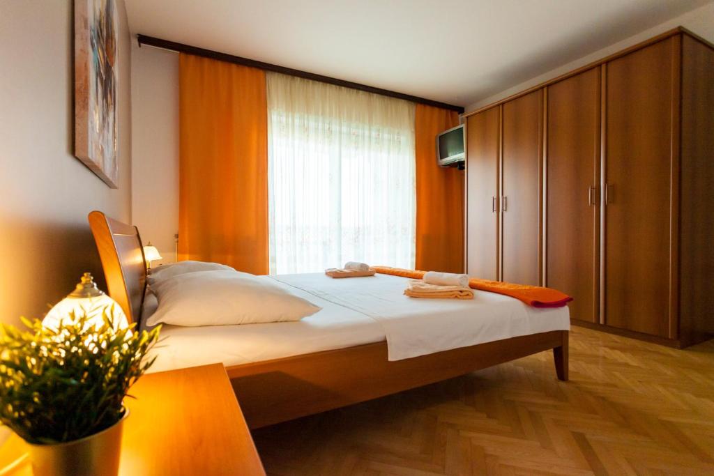 Postel nebo postele na pokoji v ubytování Apartment Meri