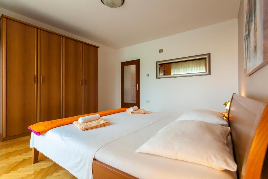 Postel nebo postele na pokoji v ubytování Apartment Meri