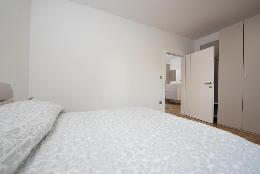 Posteľ alebo postele v izbe v ubytovaní Apartmani BILIC