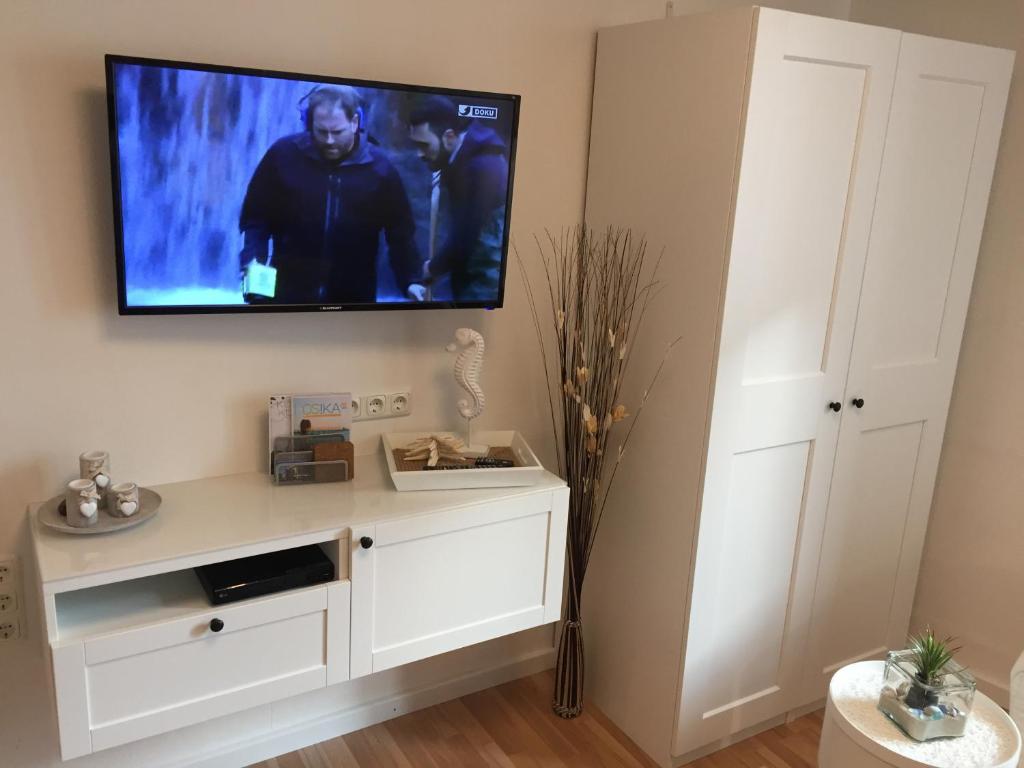 TV a/nebo společenská místnost v ubytování Haus Solymar App. Meerblick