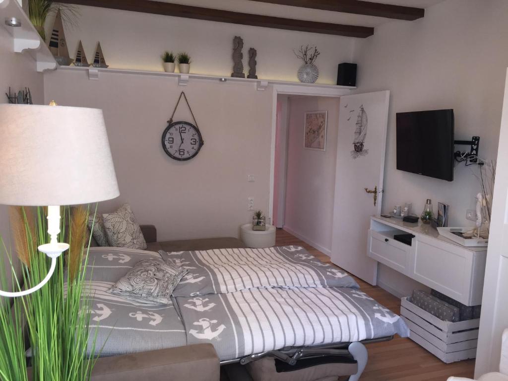 TV a/nebo společenská místnost v ubytování Haus Solymar App. Meerblick