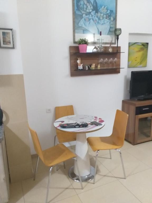 TV o dispositivi per l'intrattenimento presso Guest House Orlihome
