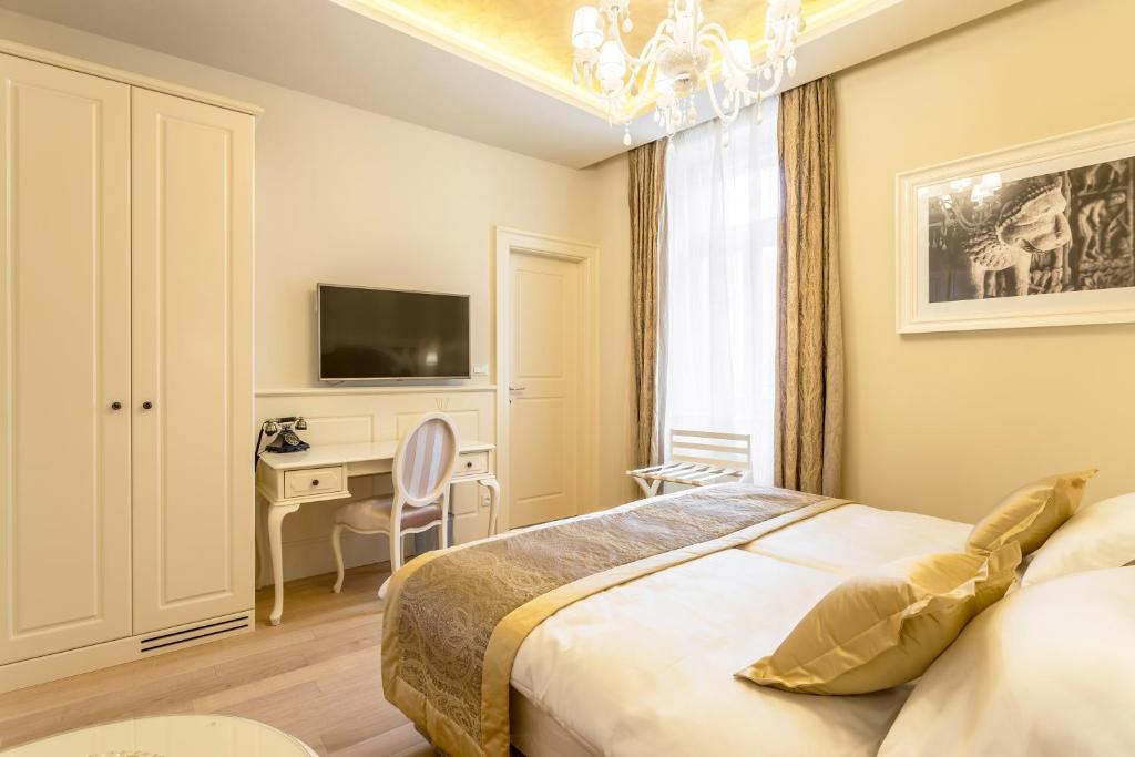 Posteľ alebo postele v izbe v ubytovaní Royal Piazza