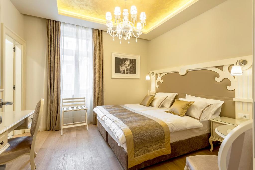 Posteľ alebo postele v izbe v ubytovaní Royal Piazza