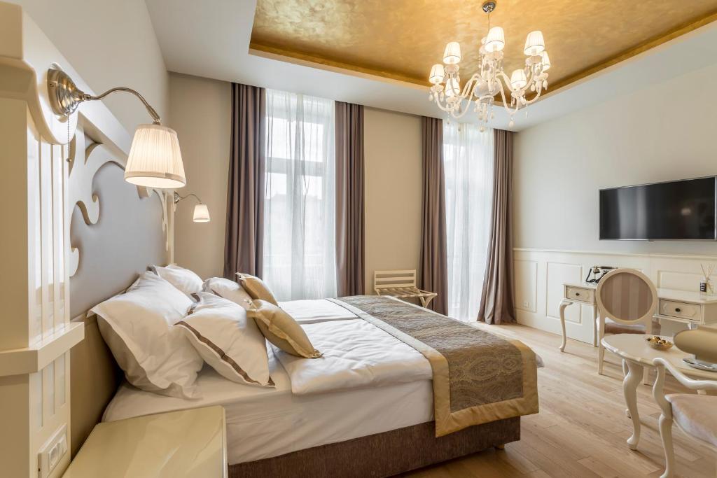 Posteľ alebo postele v izbe v ubytovaní Royal Piazza