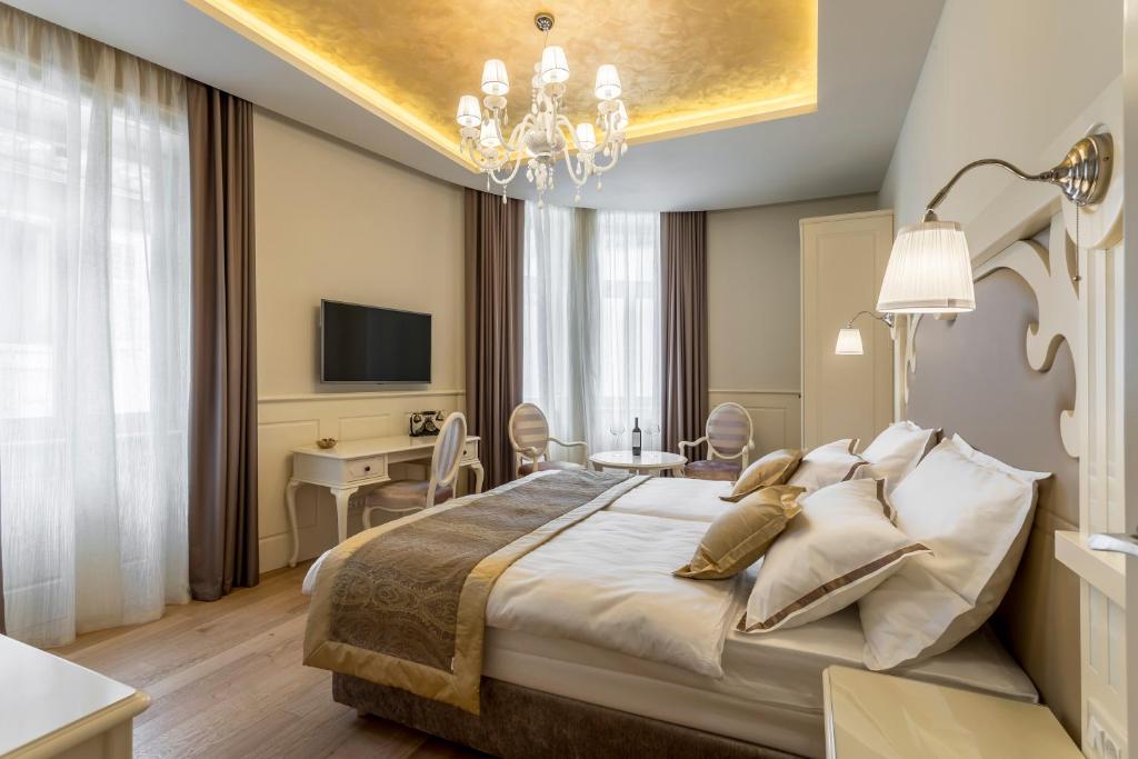 Posteľ alebo postele v izbe v ubytovaní Royal Piazza