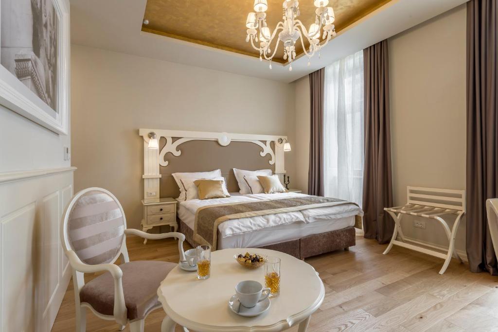 Posteľ alebo postele v izbe v ubytovaní Royal Piazza