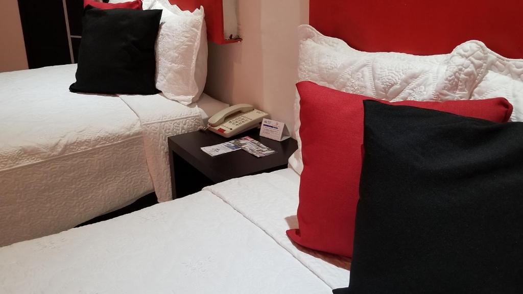 Postel nebo postele na pokoji v ubytování Hotel Dluxe
