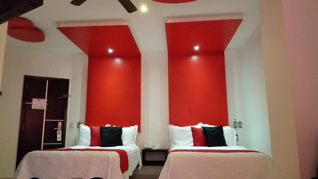 Postel nebo postele na pokoji v ubytování Hotel Dluxe