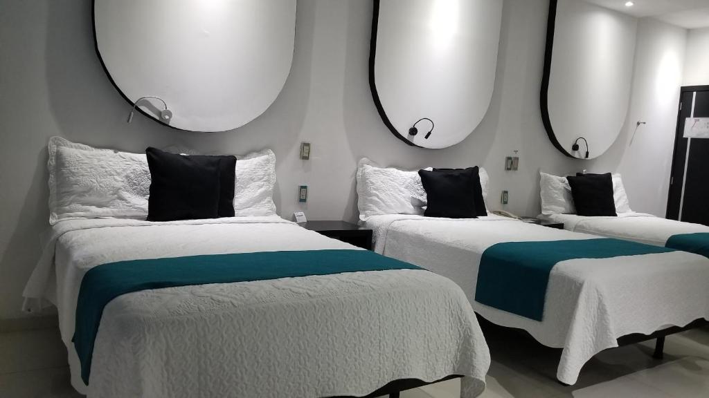 Postel nebo postele na pokoji v ubytování Hotel Dluxe