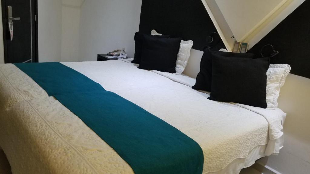Postel nebo postele na pokoji v ubytování Hotel Dluxe
