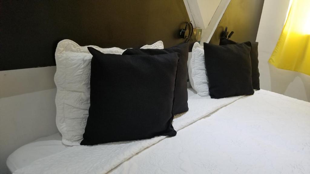 Postel nebo postele na pokoji v ubytování Hotel Dluxe