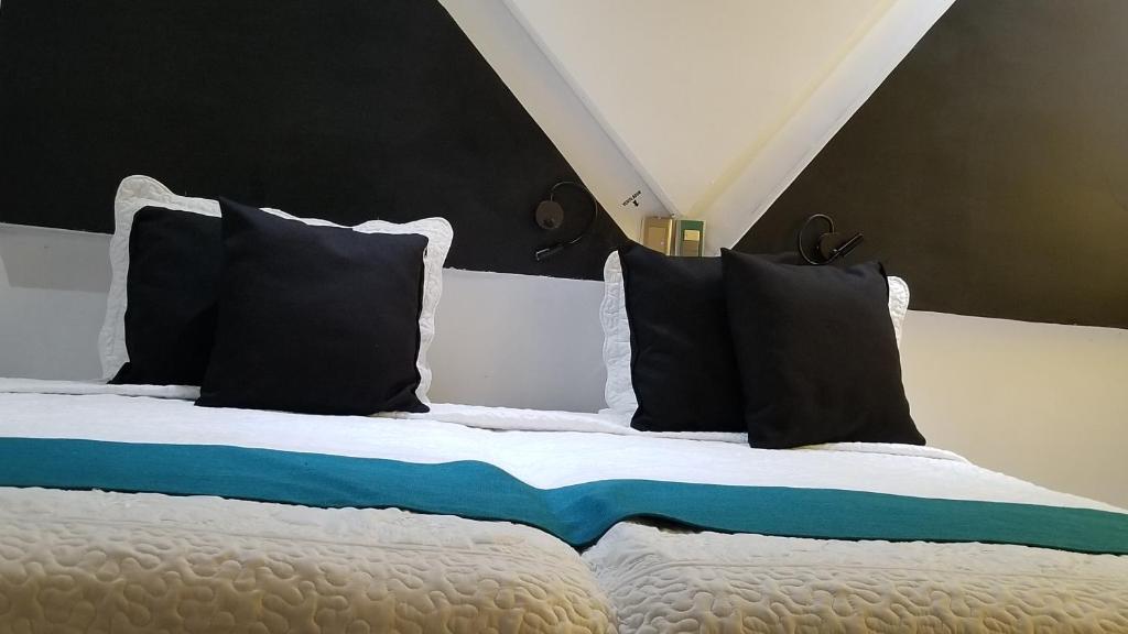 Postel nebo postele na pokoji v ubytování Hotel Dluxe