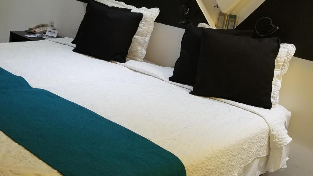 Postel nebo postele na pokoji v ubytování Hotel Dluxe