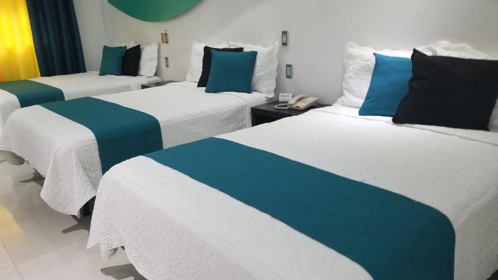 Postel nebo postele na pokoji v ubytování Hotel Dluxe