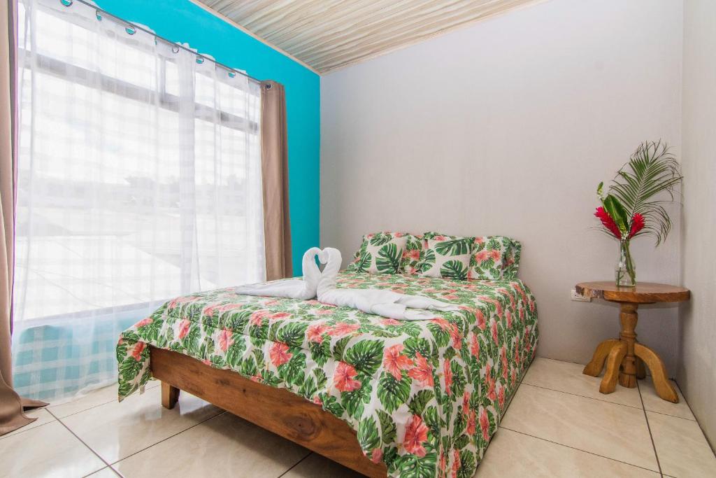a bedroom with a bed and a window at Casa Monarca - Monteverde in Monteverde Costa Rica