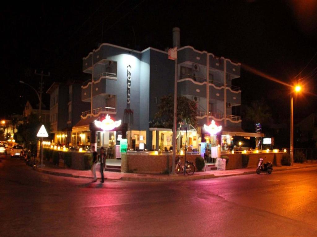 a large building with lights in front of it at night at Angels Inn Marmaris in Marmaris