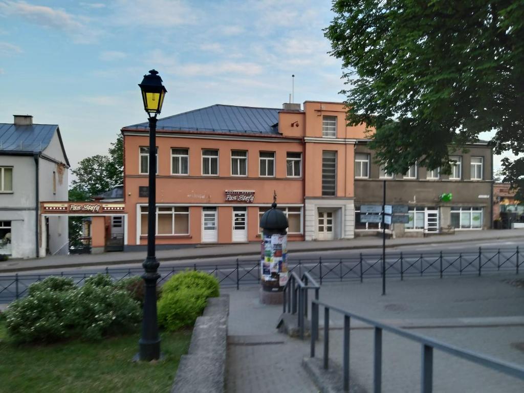 a street light in front of a building at Pas Stefą in Telšiai