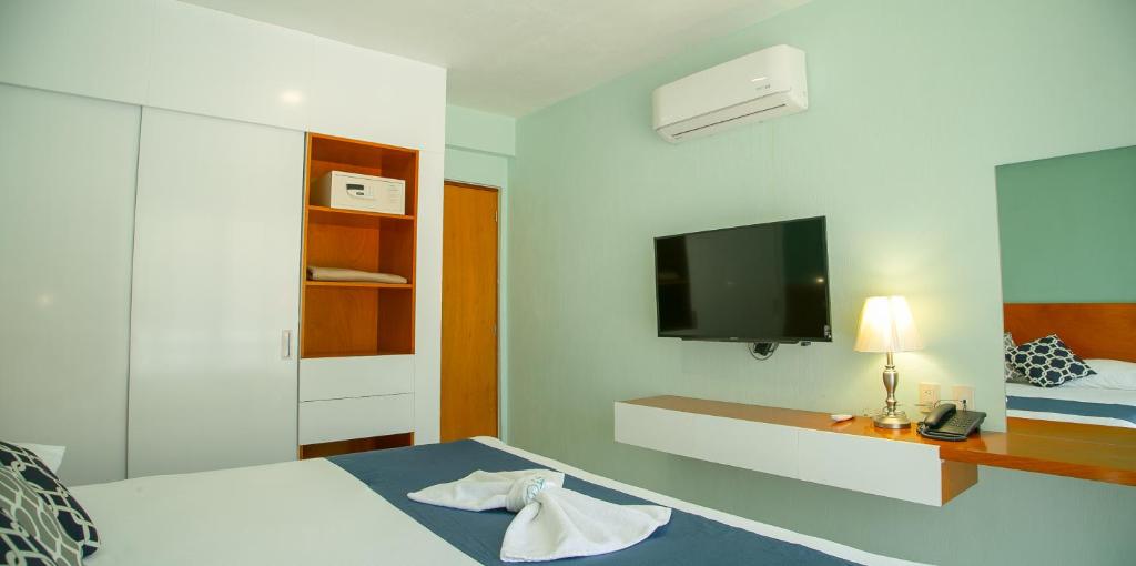 TV a/nebo společenská místnost v ubytování Relax Inn Suites