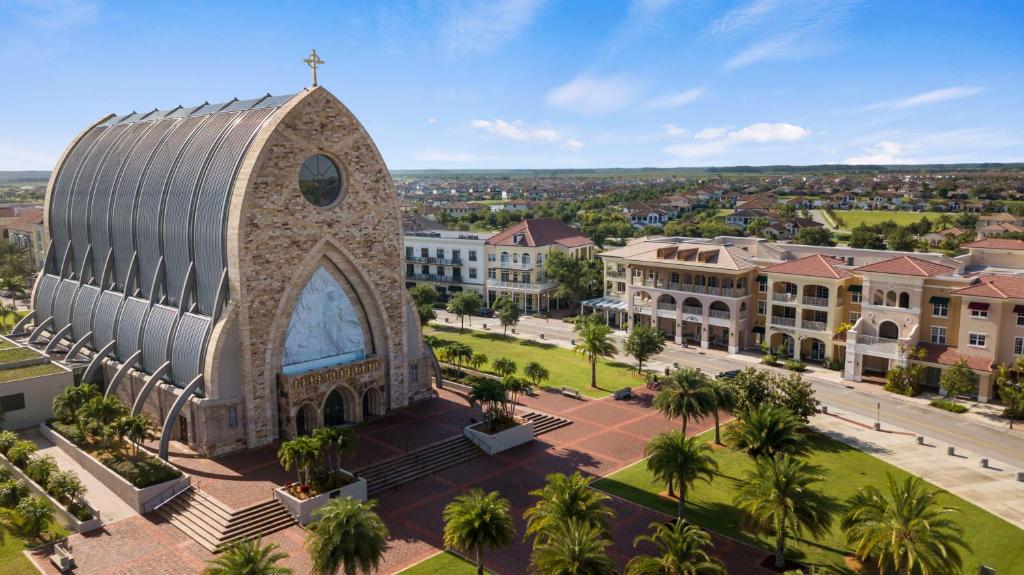 an aerial view of a church in a city at Ave Maria Rentals Fl in Immokalee
