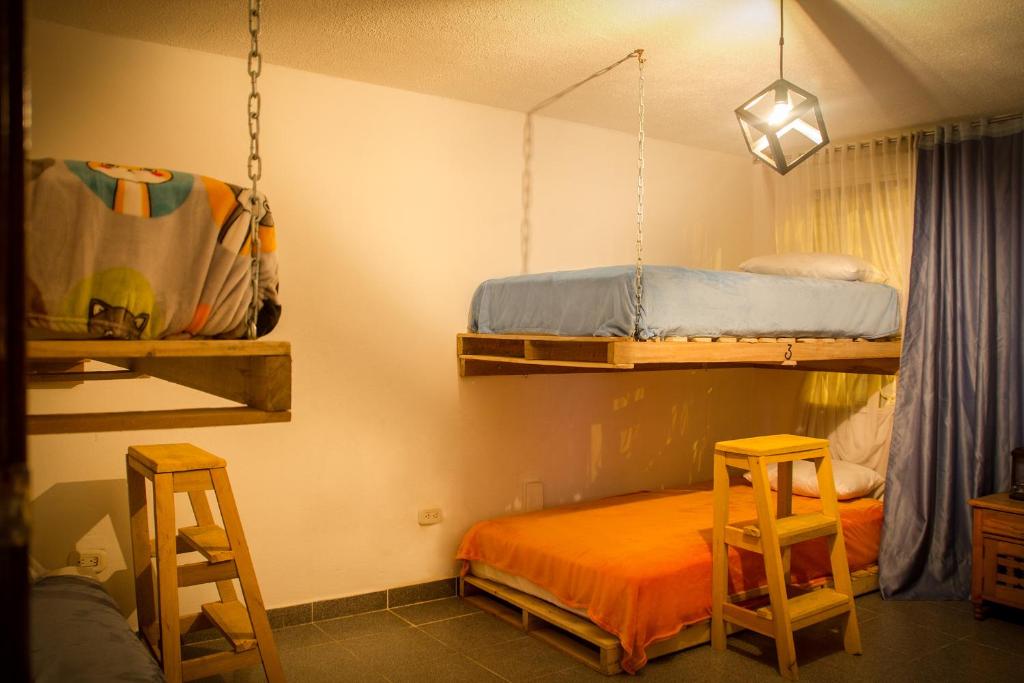 Postel nebo postele na pokoji v ubytování Bababuy Hostel