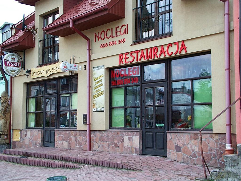 a restaurant on the side of a building at Gospoda Rycerska in Szydłów