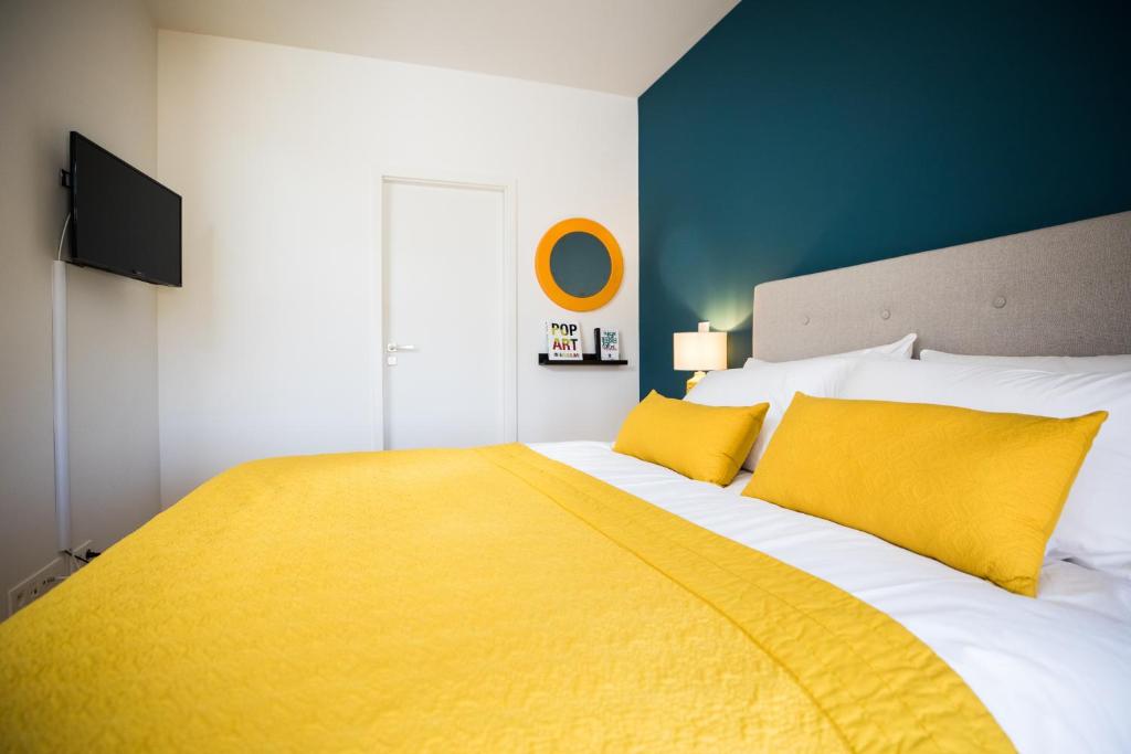 Postel nebo postele na pokoji v ubytování Chez Spoons B&B